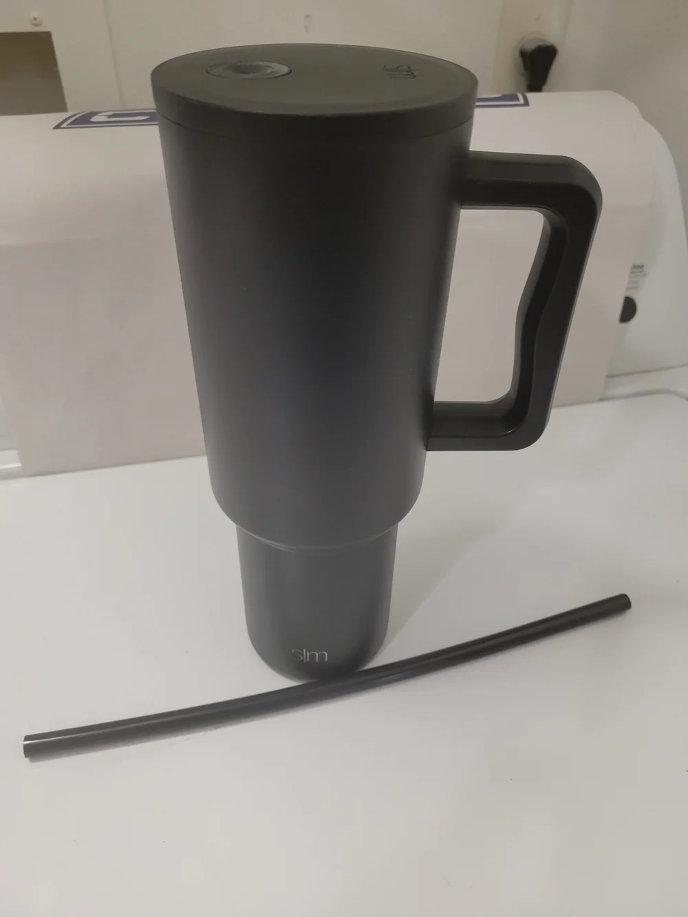 The 40 oz Trek Tumbler with Handle and Straw Lid is a reusable insulated tumbler